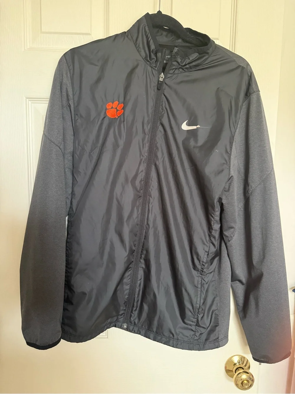 Nike Black Lightweight Jacket with Orange Paw Accent